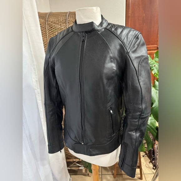 Woman's Black Leather Jacket Xelement riding motorcycle